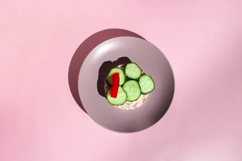 Making low calorie toast from corn crispbread and vegetables Stock Footage 285252324