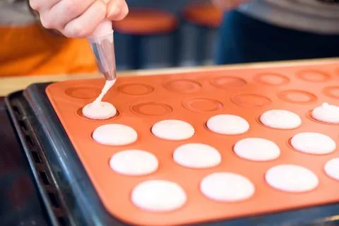 Making macarons with pastry bag Stock Photos