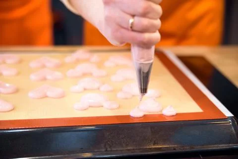 Making macarons with pastry bag Stock Photos