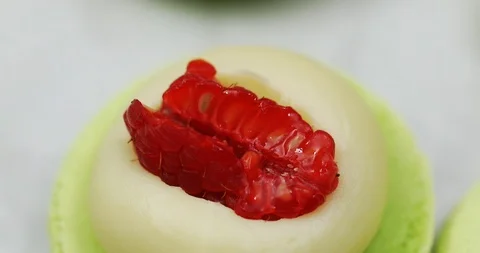 Making macaroons, filling green macaroons with cream, macro Stock Footage 101742452
