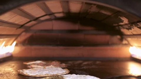 Making Manakeesh inside a gas heated oven, slow motion Stock Footage 119570139