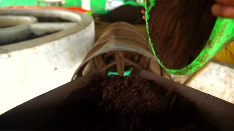 Making manire from cow dung Stock Footage 212018931