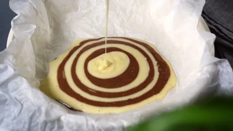 Making marble or zebra cake. Pouring white dough Video stock 181997758