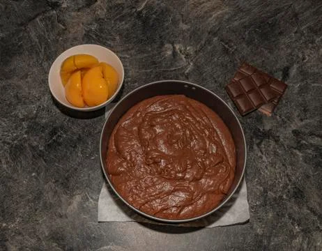 Making of marijuana brown cake with peach and strawberry fruit and cannabis l Stock Photos