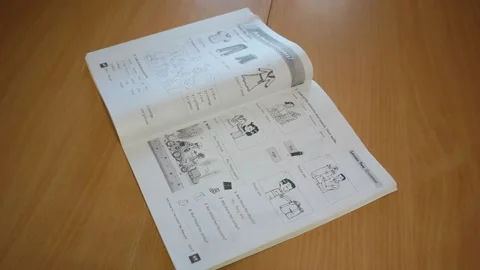 Making marks in a text book Stock Footage 131219556