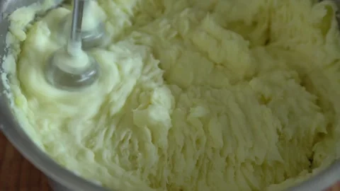 Making mashed potatoes. Beating potatoes with a mixer. Stock Footage 317220456