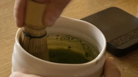 Making of matcha green tea Mixing with bamboo mixer Stock Footage 116597034