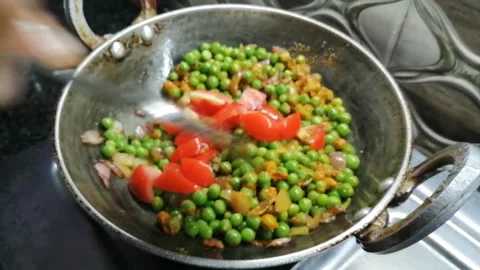 Making Mattar paneer Stock Footage 194496912