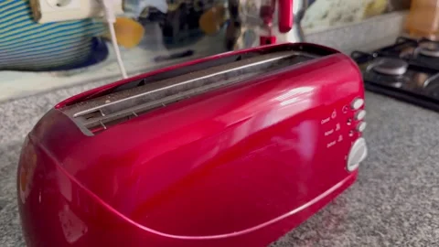 Making a meal with the toaster while enjoying the morning Stock Footage 345365217