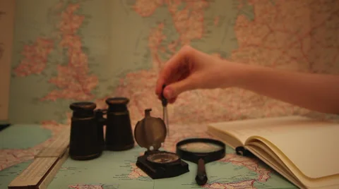 Making measurements on old map, writing in a notebook, geography Stock Footage 35924577