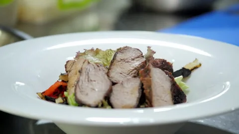 Making a Meat Dish with Grilled Vegetables Video stock 131644954
