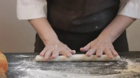 Making meat dumpling with wooden rolling pin. Stock Footage 74517714