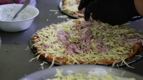 Making meat ham on pizza crusts. Stock Footage 147273215