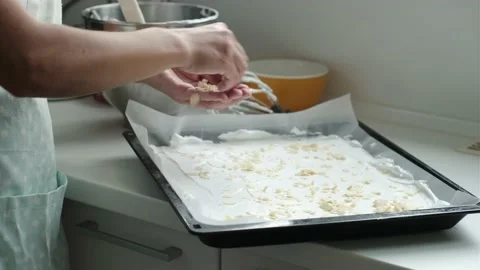 Making meringue layer with almond flakes Stock Footage 200813042
