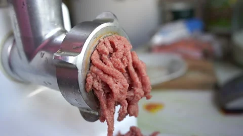 Making minced beef meat with electric meat grinder Stock Footage 132317533
