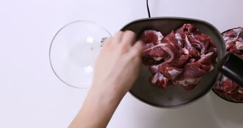 Making minced meat in an electric meat grinder from fresh beef at home Stock Footage 96679487