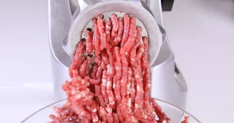 Making minced meat in an electric meat grinder from fresh beef Stock Footage 96680063