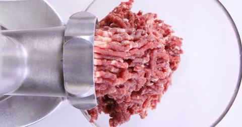 Making minced meat in an electric meat grinder from fresh beef Stock Footage 96680102