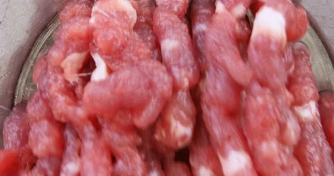 Making minced meat in an electric meat grinder from fresh beef Stock Footage 96680960