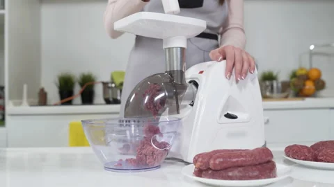 Making minced meat in electric meat grinder from fresh beef at home. Pile of 스톡 동영상 130193282
