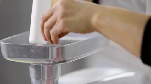 Making minced meat in the kitchen Stock Footage 243496011