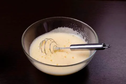 Making of mixing eggs in bowl Stock Photos