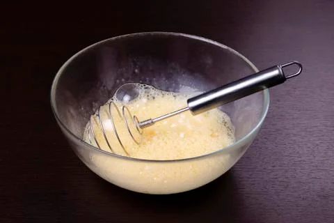 Making of mixing eggs in bowl Stock Photos