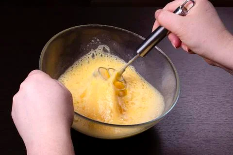 Making of mixing eggs in bowl Stock Photos