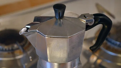 Making moka coffee at kitchen. Home breakfast routine. a woman opens coffee pot  Stock Footage 128238968