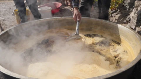 Making Molasses Ancient Way in Slow Motion Stock-Footage 256496540