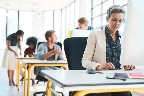 Making the most of their creativity. a group of creative designers hard at work Stock Photos