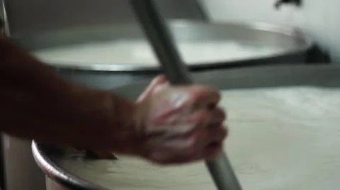 MAKING MOZZARELLA CHEESE MAN WITH THERMOMETER Stock Footage 26761723