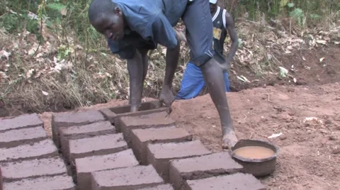 Making Mud Bricks in Rural African Village Stock Footage 51852625
