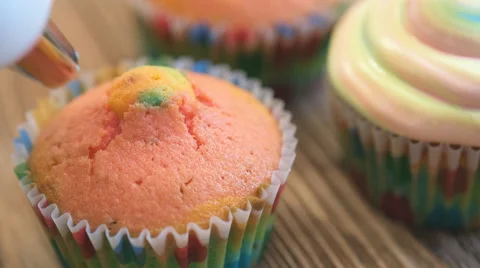 Making multicolor cupcakes . Stock Footage 65023940