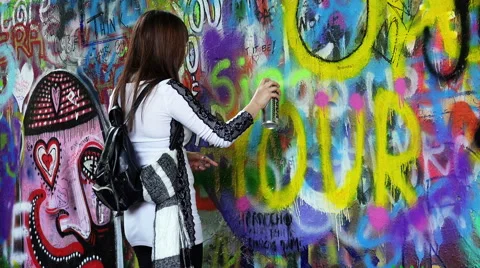 Making murals on the Lennon Wall in Prague Stock Footage