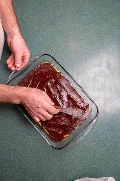 Making Nanaimo Bars in a Kitchen Stock Photos