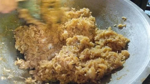 Making Nasi Lemak from sticky rice in a hot pan Stock Footage 306471671