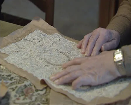 Making needlepoint lace, verifying a pattern - close up Stock Footage 25314643