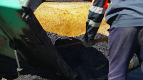 Making new asphalt at road construction. Machine is pouring asphalt for road Video stock 249933846