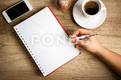 Making notes on coffee break Stock Photos