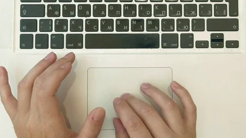 Making notes in paper notebook using a laptop pc Stock Footage 70005861