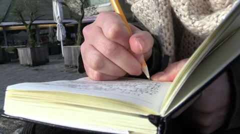 Making notes in public, close up Stock Footage 33736344