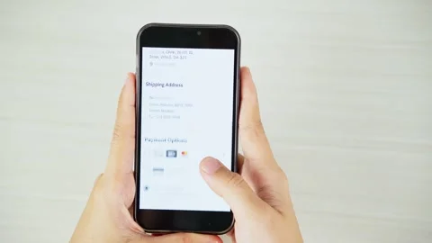 Making Online Purchase Using Smartphone From Top View Video stock 347178121