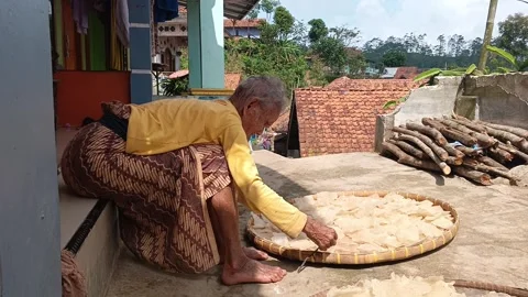 The making of opak, a traditional cassava cracker. Stock Footage 317934170