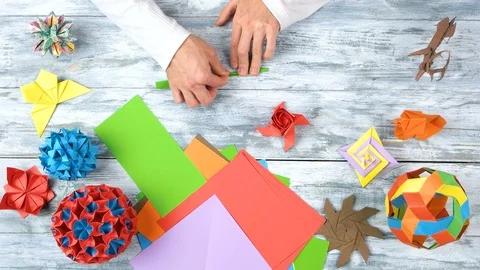 Making origami rose with stem, top view. Video stock 93287542