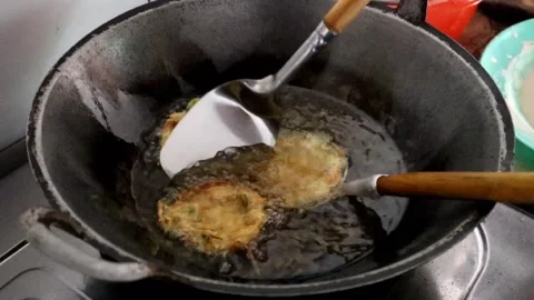 Making ote ote or bakwan on the frying pan. Stock Footage 231479282