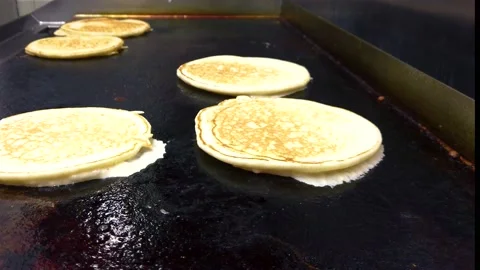 Making Pancakes On Electric Griddle. Breakfast UK Stock Footage 228647173