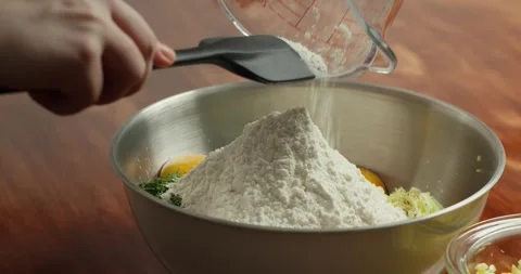 Making pancakes from grated zucchini. Mixing all ingredients in a special bowl Stock Footage 319388936