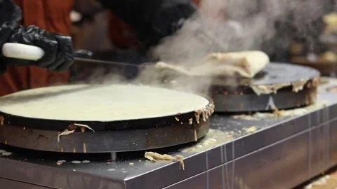 Making pancakes on a pancake maker Stock Footage 303307987
