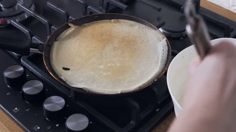 Making pancakes on two pans Stock Footage 72204897